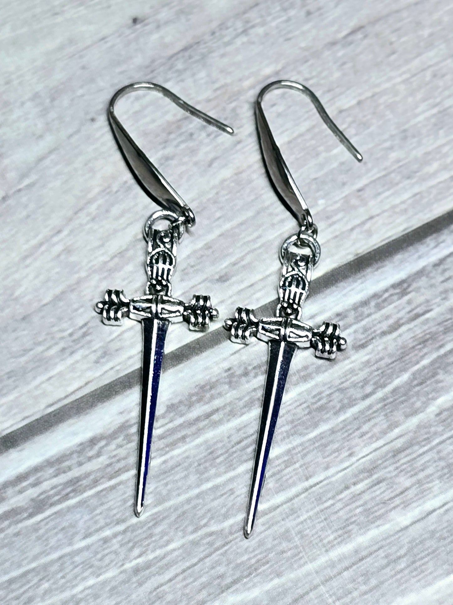 Silver Dangle Dagger Earrings.