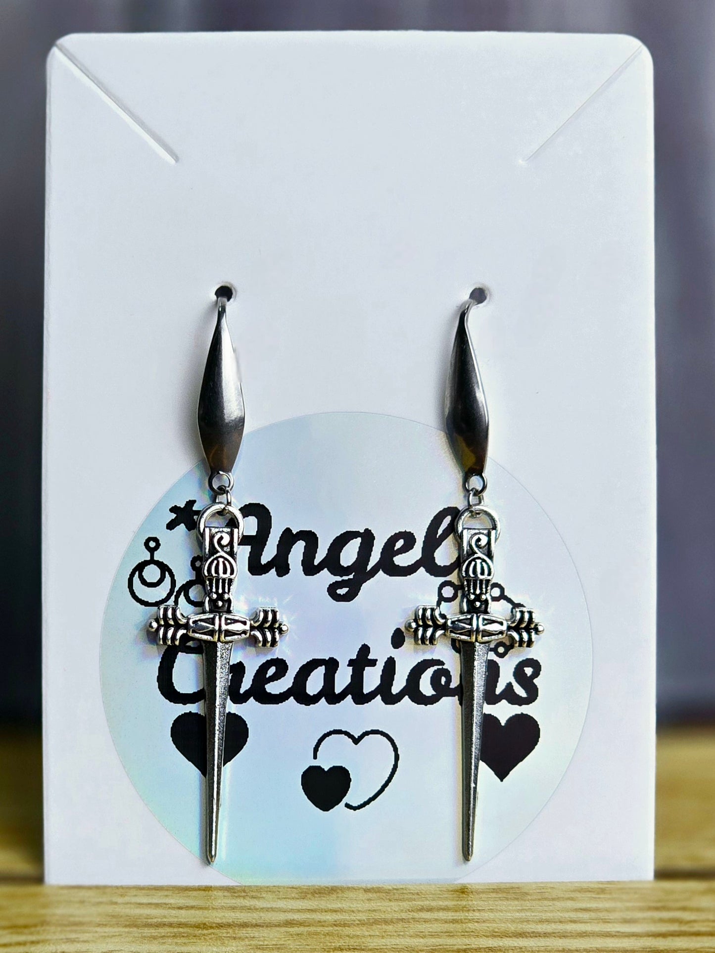 Silver Dangle Dagger Earrings.
